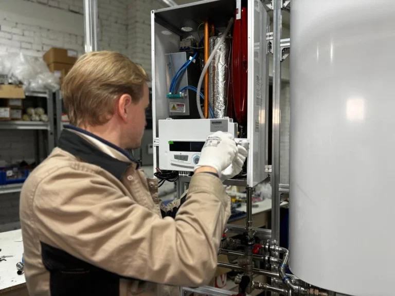 Technician servicing a home heating and water system