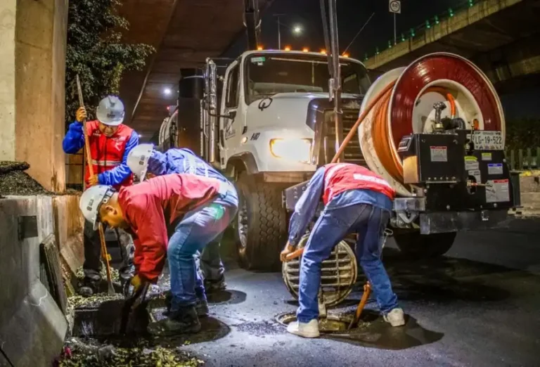 Crew cleaning a sewer drain